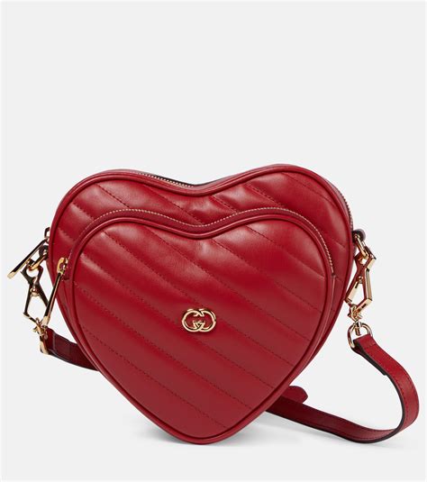 white gucci bag with heart on back|gucci interlocking shoulder bag.